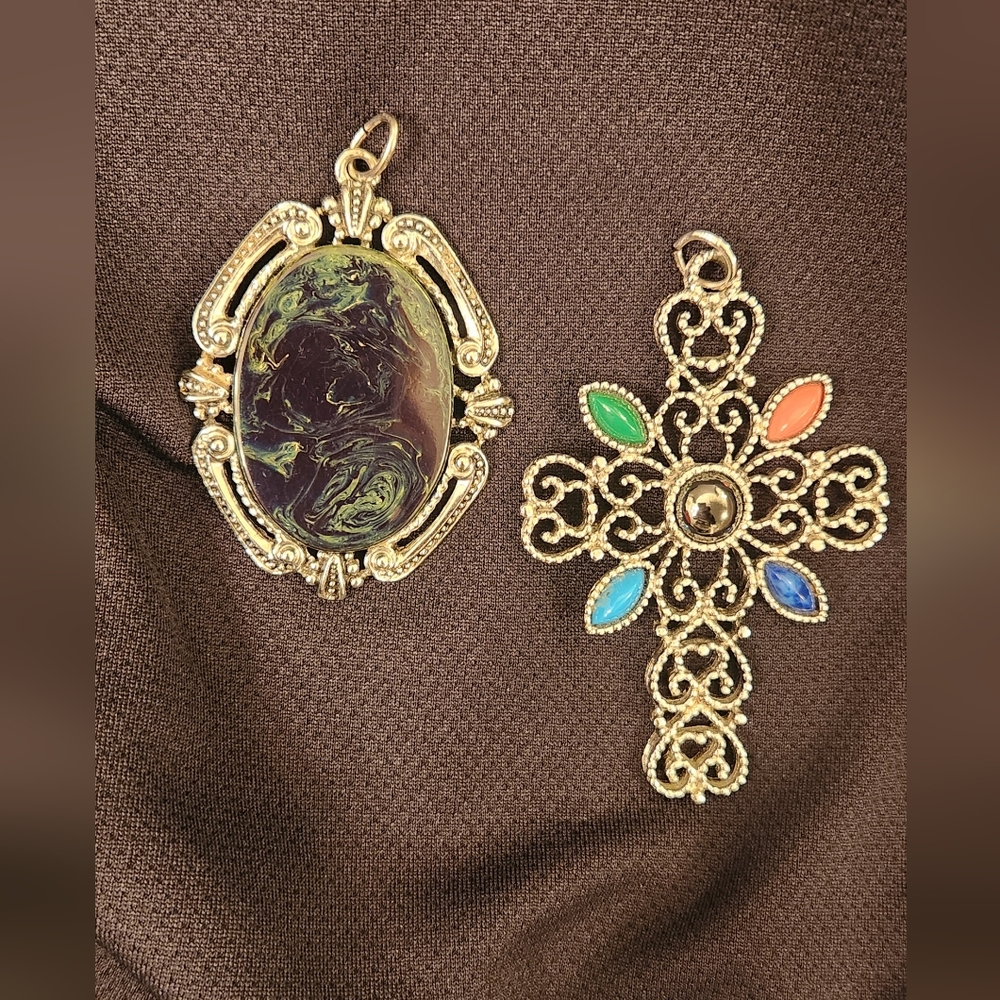 2 Pendants. Cross and green oval stone.